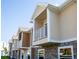 Tan and brown multi-Gathering building with balconies at 107 Oceans Cir, Daytona Beach Shores, FL 32118
