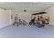 Garage with golf cart, bicycles, and ample storage space at 107 Oceans Cir, Daytona Beach Shores, FL 32118