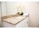 Bathroom with granite countertop, white cabinets, and a modern sink at 107 Oceans Cir, Daytona Beach Shores, FL 32118