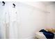 Walk-in closet with ample shelving and a comfortable ottoman at 107 Oceans Cir, Daytona Beach Shores, FL 32118