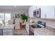 Modern kitchen with white cabinets, granite counters and stainless steel appliances at 107 Oceans Cir, Daytona Beach Shores, FL 32118