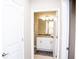Clean bathroom with granite countertop and white cabinets at 107 Oceans Cir, Daytona Beach Shores, FL 32118