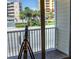 Balcony overlooking the street and ocean with a telescope at 107 Oceans Cir, Daytona Beach Shores, FL 32118