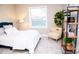 Bedroom with a blue headboard, white bedding, and a yellow chair at 107 Oceans Cir, Daytona Beach Shores, FL 32118
