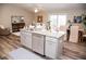 Kitchen island with granite countertop, sink, and dishwasher at 107 Oceans Cir, Daytona Beach Shores, FL 32118