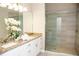 Elegant bathroom with double vanity and a walk-in shower at 107 Oceans Cir, Daytona Beach Shores, FL 32118