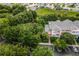 Community playground surrounded by lush green trees, next to building at 101 New Providence # 9101, Davenport, FL 33897