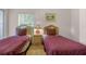 Bedroom with two twin beds, nightstands and a large closet at 101 New Providence # 9101, Davenport, FL 33897