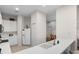 Kitchen with white cabinets, double sink, and refrigerator at 101 New Providence # 9101, Davenport, FL 33897