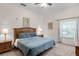 Main bedroom with king-size bed, ceiling fan, and ensuite bathroom at 101 New Providence # 9101, Davenport, FL 33897