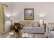 Living room features neutral colored couch and a large framed picture at 101 New Providence # 9101, Davenport, FL 33897