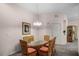 Bright dining room with glass-top table and wicker chairs at 101 New Providence # 9101, Davenport, FL 33897