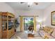 Spacious living room with a view of the kitchen and dining area, and access to the patio at 101 New Providence # 9101, Davenport, FL 33897