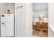 View of kitchen with white cabinets and appliances at 101 New Providence # 9101, Davenport, FL 33897