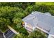 Aerial view of building exterior, showcasing gray roof and balconies at 101 New Providence # 9101, Davenport, FL 33897