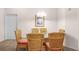 Dining room with wicker chairs and glass table at 101 New Providence # 9101, Davenport, FL 33897