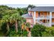 Two-story building with balconies and palm trees at 101 New Providence # 9101, Davenport, FL 33897