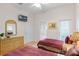 Bedroom with two twin beds, dresser, and private access to bathroom at 101 New Providence # 9101, Davenport, FL 33897
