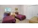 Bedroom with two twin beds, nightstands and a large closet at 101 New Providence # 9101, Davenport, FL 33897