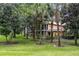 Two-story building with balconies, surrounded by lush landscaping at 101 New Providence # 9101, Davenport, FL 33897