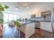 Modern kitchen with stainless steel appliances and island, open to living area at 150 E Robinson St # 3106, Orlando, FL 32801