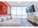 Bright bedroom with terracotta wall and city view at 150 E Robinson St # 3106, Orlando, FL 32801