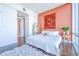 Bright bedroom with terracotta wall and city view at 150 E Robinson St # 3106, Orlando, FL 32801