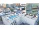 Aerial view of a building with a pool and tennis court at 150 E Robinson St # 3106, Orlando, FL 32801