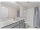 Clean bathroom with single vanity and bathtub shower combo at 3113 Aqua Virgo Loop # 53, Orlando, FL 32837