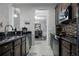 Sleek kitchen with granite countertops, dark cabinets, and a view to the dining area at 3356 Robert Trent Jones Dr # 101, Orlando, FL 32835