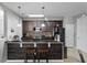 Well-equipped kitchen featuring dark wood cabinets and stainless steel appliances at 3356 Robert Trent Jones Dr # 101, Orlando, FL 32835