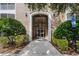 Attractive building entrance with landscaping at 3356 Robert Trent Jones Dr # 101, Orlando, FL 32835