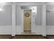 Inviting condo entryway with decorative wreath and neutral color palette at 3356 Robert Trent Jones Dr # 101, Orlando, FL 32835