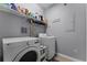 Laundry room with LG washer and dryer and storage shelves at 3356 Robert Trent Jones Dr # 101, Orlando, FL 32835