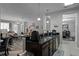 Modern kitchen with dark cabinetry, granite countertops and breakfast bar at 3356 Robert Trent Jones Dr # 101, Orlando, FL 32835