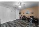Bright bedroom with two armchairs and a home exercise bike at 3356 Robert Trent Jones Dr # 101, Orlando, FL 32835