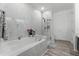 Modern bathroom featuring a soaking tub and glass shower at 3356 Robert Trent Jones Dr # 101, Orlando, FL 32835