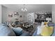 Open-concept living room with a view into the kitchen and dining areas at 3356 Robert Trent Jones Dr # 101, Orlando, FL 32835