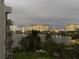 Stunning aerial view of the condo, showcasing the resort-style amenities and beautiful lake at 6165 Carrier Dr # 2602, Orlando, FL 32819