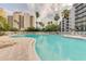 Resort-style pool with lounge chairs at 6165 Carrier Dr # 2602, Orlando, FL 32819