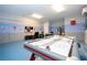 Game room with foosball, air hockey, and TV at 9043 Sunshine Ridge Loop, Kissimmee, FL 34747