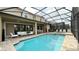 Large pool with covered patio and lounge area at 9043 Sunshine Ridge Loop, Kissimmee, FL 34747