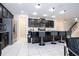 Modern kitchen with island, stainless steel appliances, and granite countertops at 9043 Sunshine Ridge Loop, Kissimmee, FL 34747