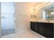 Bathroom with double vanity and walk-in closet at 9043 Sunshine Ridge Loop, Kissimmee, FL 34747