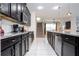 Modern kitchen with granite countertops and stainless steel appliances at 9043 Sunshine Ridge Loop, Kissimmee, FL 34747