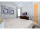 Spacious bedroom with TV and en-suite bathroom at 9043 Sunshine Ridge Loop, Kissimmee, FL 34747