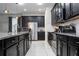 Modern kitchen with stainless steel appliances and granite countertops at 9043 Sunshine Ridge Loop, Kissimmee, FL 34747