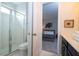 Bathroom with shower, toilet, and view into bedroom at 9043 Sunshine Ridge Loop, Kissimmee, FL 34747