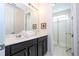 Bathroom with double sinks and a shower at 9043 Sunshine Ridge Loop, Kissimmee, FL 34747