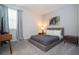 Bedroom with a queen bed, mid-century modern furniture, and large closet at 9043 Sunshine Ridge Loop, Kissimmee, FL 34747